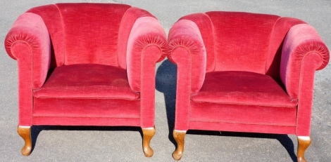 A pair of late Victorian tub chairs, each later re-upholstered in red velvet button back material, on walnut legs with spring bases, 71cm high, 73cm wide, 68cm deep.