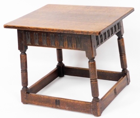 A 19thC oak side table, the rectangular top above carved frieze panel on square frame base, 53cm high, 65cm wide, 53cm deep.