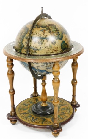 A terrestrial globe on stand, reproduction, 90cm high, 47cm wide.