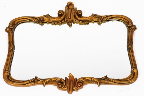 A late 20thC gilt framed wall mirror, with rococo scroll detailing, 70cm x 55cm.