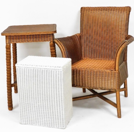 A group of Lloyd Loom furnishings, to include a white painted and Lloyd Loom stamped linen basket, 50cm high. 38cm wide, 25cm deep, together with a gilt painted Lloyd Loom style table and chair, unmarked, the chair 89cm high, 64cm wide, 50cm deep, the tab