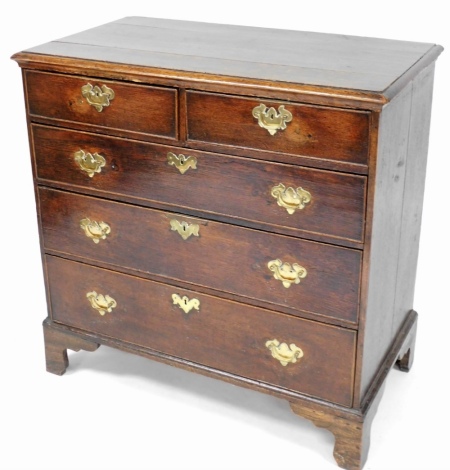 A George III chest, of two short and three long drawers, each with brass handles on bracket feet, 82cm high, 92cm wide, 50cm deep.