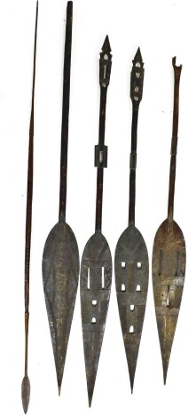 Tribal Art. A group of four wooden paddles and associated spear. (5)