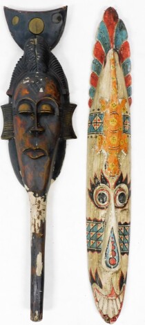 Tribal Art. Two painted wall masks, 99cm high and 97cm high.