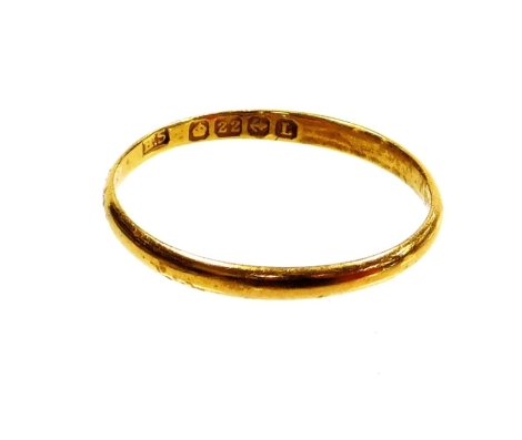 A 22ct gold thin wedding band, ring size J½, 1.2g.