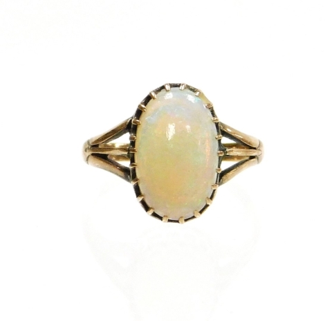 A 9ct gold opal dress ring, set with oval opal in claw setting, with three strand v splayed shoulders, ring size K, 1.9g all in.