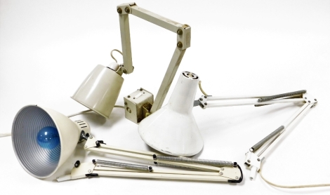 Three various angle poised lamps, two white and one grey, each desk mountable, 91cm high, 94cm high and 88cm high