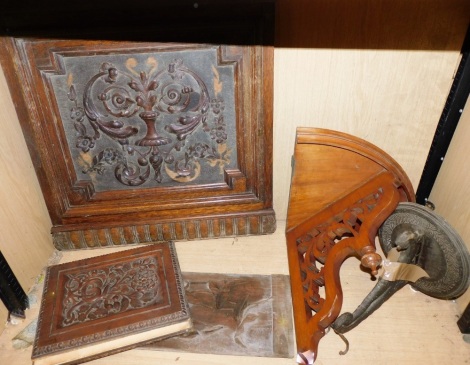 A group of carved wooden shelf brackets and panels, the three panels each with foliate scrolling and masks, with two corner shelf brackets. (5)