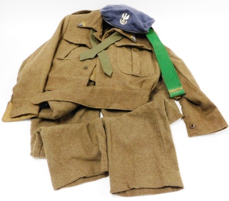 A British Army Poland parachute reserve officers uniform, including jacket belt trousers and cap.