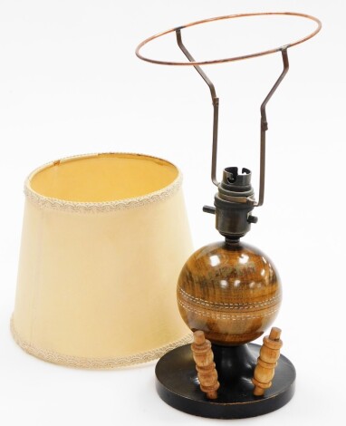 Cricketing Interest. A table lamp, modelled as a cricket ball and with two bails, 34cm high.