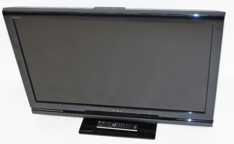 A Sony Bravia 40'' flat screen television, with remote control.