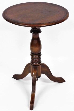 An early 19thC mahogany tripod table, the circular top above tripod base, 71cm, 50cm diameter.