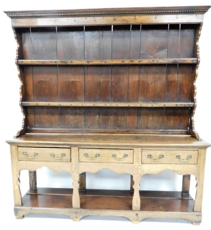 A 19thC oak Welsh dresser, with two shelf top, on three drawer base with brass handles, 192cm high, 175cm wide, 45cm deep.