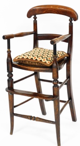 A Victorian mahogany child's high chair, with pierced seat, 83cm high, 37cm wide, 34cm deep.