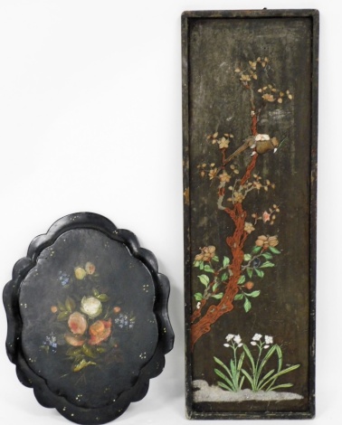 A Japanese decorated panel, and a papier mache tray, the panel with various applied detailing of birds and leaves, 120cm high, 39cm wide (AF), together with a papier mache black painted and florally applied tray, 63cm diameter. (2)