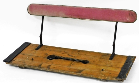 A French early 20thC horse cart seat, with pink upholstered back on metal supports, 111cm wide, 38cm deep.