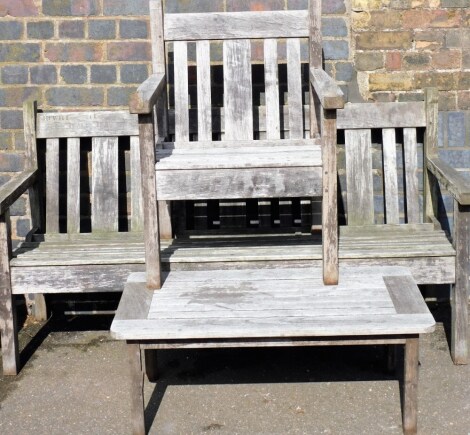 Various wooden slated furniture, to include a wooden garden bench stamped Hewitt Tealby, 86cm high, 162cm wide, 66cm deep, together with associated chair and low table. (3)