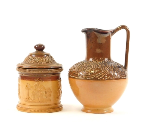 Two Royal Doulton stoneware ceramics, to include a jar and cover, 16cm high, and a tapered jug, 20cm high.