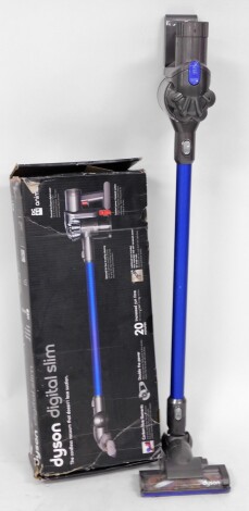 A Dyson CC44 Animal hand held vacuum cleaner, with accessories and wall mounted charging section, boxed.