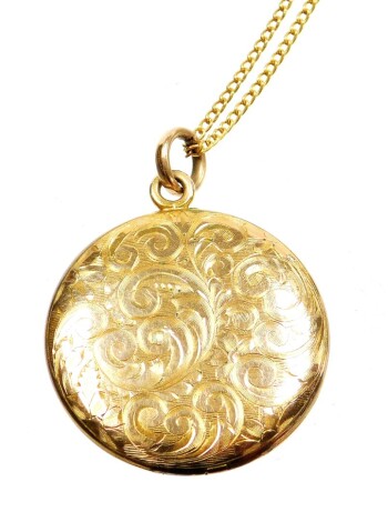 A 9ct gold locket and chain, the circular locket with floral scrolling, bearing initials HJB to reverse, on a fine link 9ct gold chain, 9.8g all in.