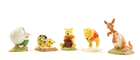 Five Royal Doulton Winnie The Pooh collection figures, Piglet and the balloon, Kanga, Winnie The Pooh and footprints, Tigger signs, and Pooh and honey pot, boxed. (5)