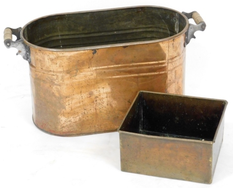 A Victorian copper pan, elongated oval border, with wooden handles, 33cm high, 66cm wide, 30cm deep, and a further rectangular planter. (2)