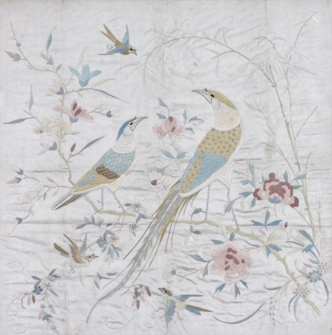 A late 19thC Chinese embroidered picture, of flowers and pheasant on a silk cream background, 82cm x 52cm, framed and glazed.