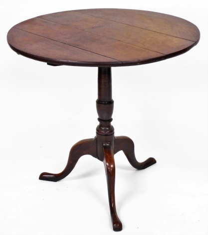 A 19thC oak tripod table, 72cm high, 75cm diameter.