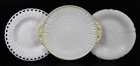 A second period Belleek Limpet bread plate, two handled, second period black mark, 28cm wide a Belleek first period basket desert plate, black mark and impressed Belleek County Fermangh, 24cm diameter; and a first period (unmarked) Echinus pattern bread 