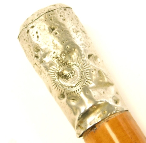 A police walking stick, with hammered detailing, silver plated cap with ER stamp, on an ebony cane, 86cm long.