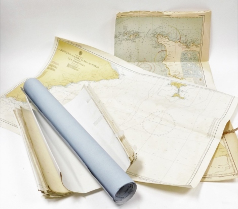 A group of various nautical charts.