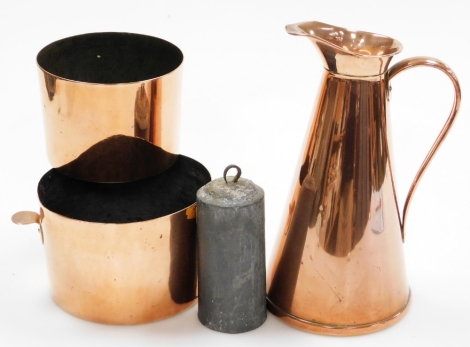 A plain copper jug, stamped J.S.&S, 27.5cm high, two old copper cylindrical pots and a lead clock weight. (4)