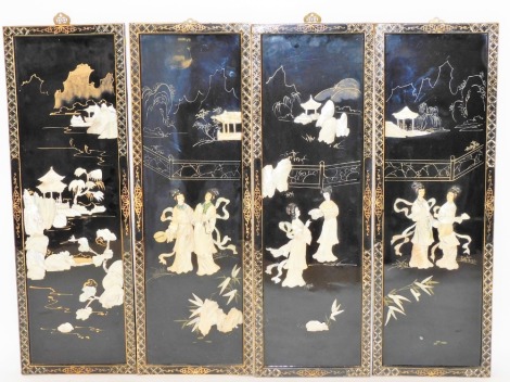 A set of four Oriental black lacquered and mother of pearl inlaid panels, each with figures and building scenes, on a patterned border with brass hanging hook, 92cm high, 30cm wide, 2cm deep. (4)