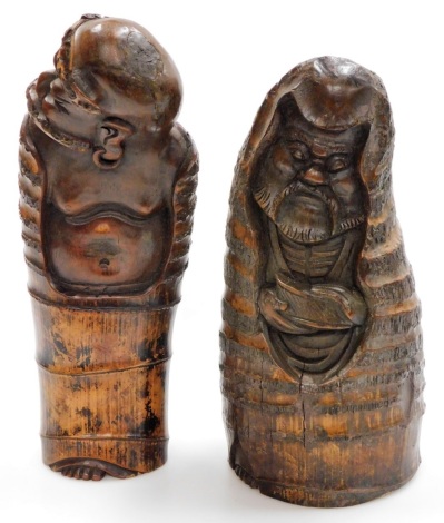 Tribal Art. Two carved bamboo root lohan figures, 33cm and 36cm high.