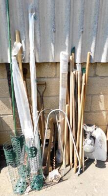 Various garden equipment, to include tools, snow shovel, bird feeders, sticks, a metal wall mounted sink, etc.