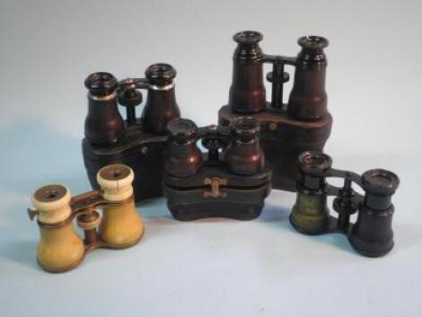 A pair of Ivory mounted opera glasses and four pairs of brass and black