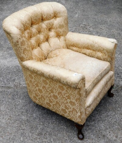 A bedroom chair, upholstered in gold damask fabric, with walnut legs (AF), 80cm high, 75cm wide, 60cm deep.