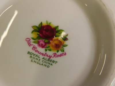 A large collection of Royal Albert Old Country Roses pattern porcelain, to include two teapots, cups, saucers, two circular boxes and covers, place mats, dinner plates, etc. - 2