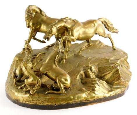 A late 19th/early 20thC bronze figure group, of wolves attacking a young foal and horses on a stylised rock base, with ebonised plinth, polished, (AF), 45cm wide.