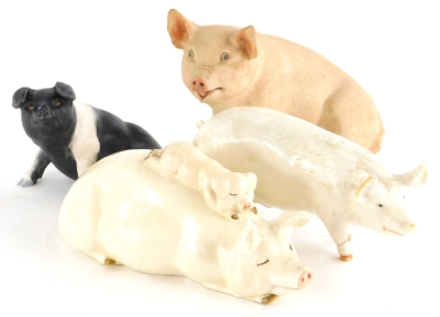 Two Beswick pigs, to include a figure of a pig with a piglet, another Champion Wall Queen, a Country Life Design Studio matte glazed pig and an Aynsley pig. (4)