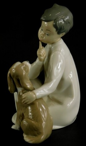 A Lladro porcelain figure group of a young child with a Spaniel puppy, impress number 45226, 19cm high.