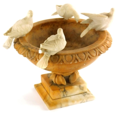 A late 19thC Grand Tour carved alabaster urn, mounted with the Four Doves of Pliny, 23cm wide.