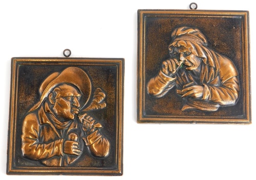 A pair of cast copper panels, each decorated with figures in Dutch style, 15cm x 14cm.