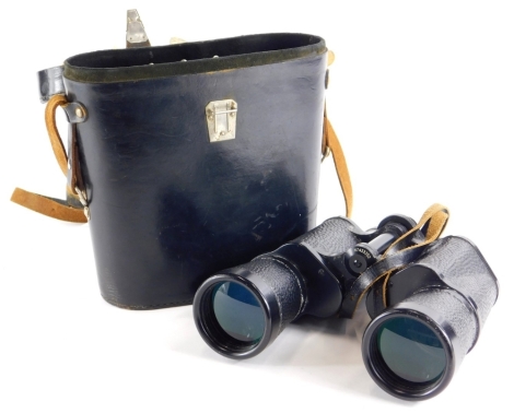 A pair of Russian 7x50 binoculars, in blackened metal, with black grips, sold with instructions in Russian, in a fitted case.