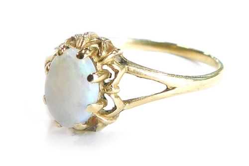 A 9ct gold dress ring, set with oval cut opal, in claw setting with flower design border, ring size N, 1.4g all in.