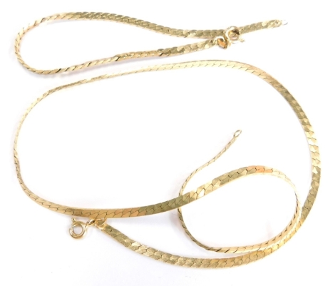 A 9ct gold necklace and bracelet set, of fine two row links, the bracelet 18cm long, the necklace 40cm long, 11.1g. (boxed)