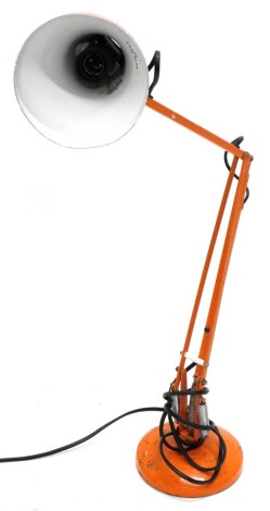 A vintage orange painted Anglepoise type lamp, 92cm high.