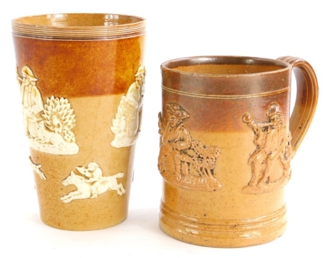 A Doulton Lambeth stoneware tapering beaker, decorated with huntsmen figures etc., and a stoneware mug. (2)