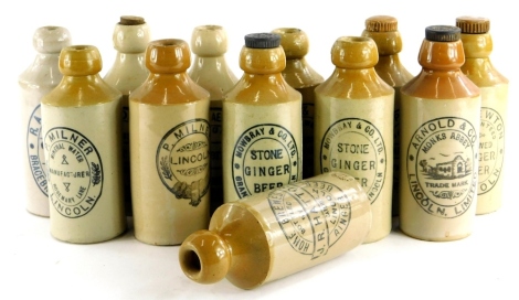 A collection of Lincoln related ginger beer bottles, stamped Hatton, Mowbray, Milner, Dobson, Newton, Arnold, Marfleet, the Bracebridge Aerated Water Company, and Parke and White. (12)