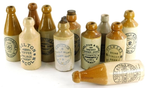 A collection of Lincoln related stoneware ginger bottles, to include Skelton, Draper, Claxton, Rose, Arnold, Martin's, Neal, Boulton of Alford, Farmer's Spilsby, Carlton and Sons of Woodhall Spa, etc. (11)